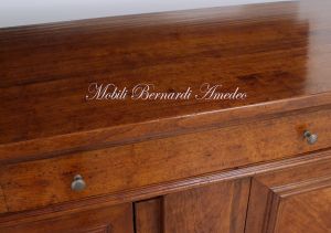 Sideboard in walnut wood with inlaid olive wood doors